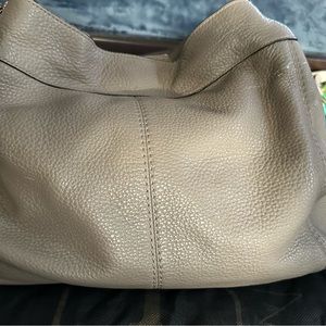 Gray Coach handbag.
